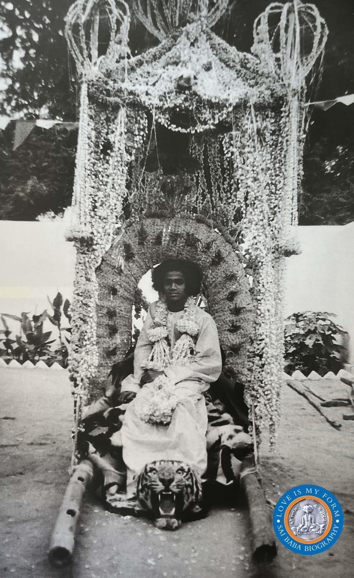 Sri Sathya Sai Baba seated in a palanquin Puttaparthi Mandir. Photo from Love Is My Form: The Advent Book by R. Padmanaban